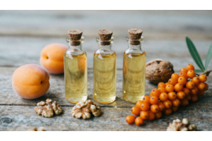 Apricot, walnut, and sea buckthorn oils in glass bottles with natural ingredients from Pakistan’s northern regions