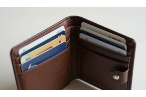 Slim minimalist leather wallet with essential cards arranged neatly for a sleek everyday carry